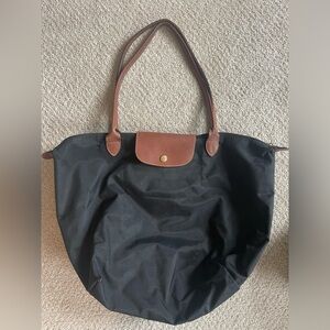 Original Longchamp Le Pliage bag. Black with tan straps